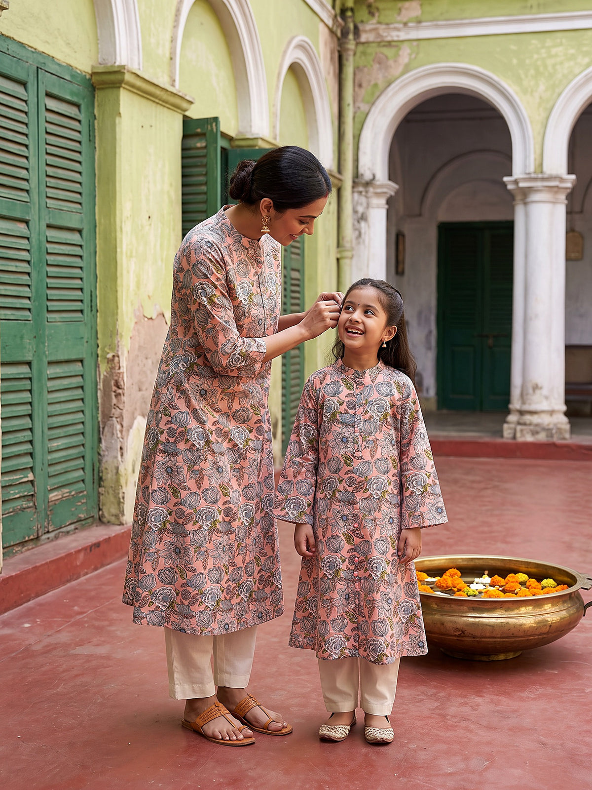Mother and daughter candid in pink floral kurtis