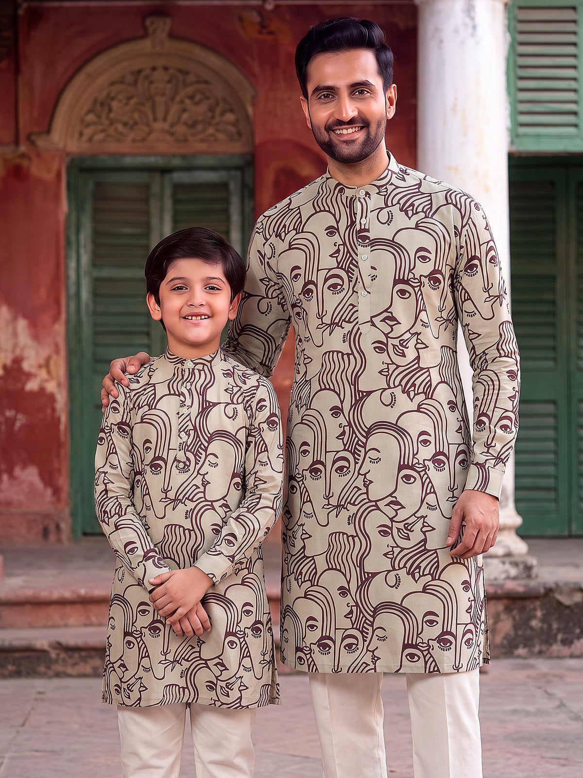 Father and son in matching maroon face art printed kurtas
