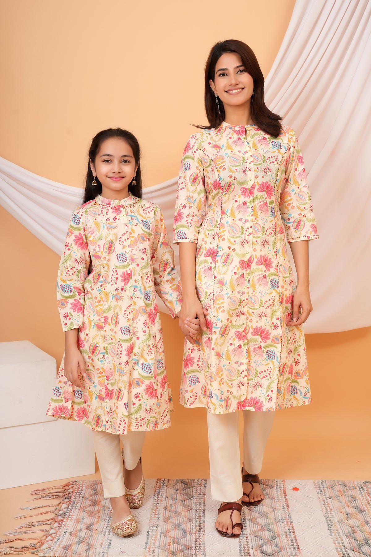 Maa and Beti in matching cream multicolour floral printed kurtis