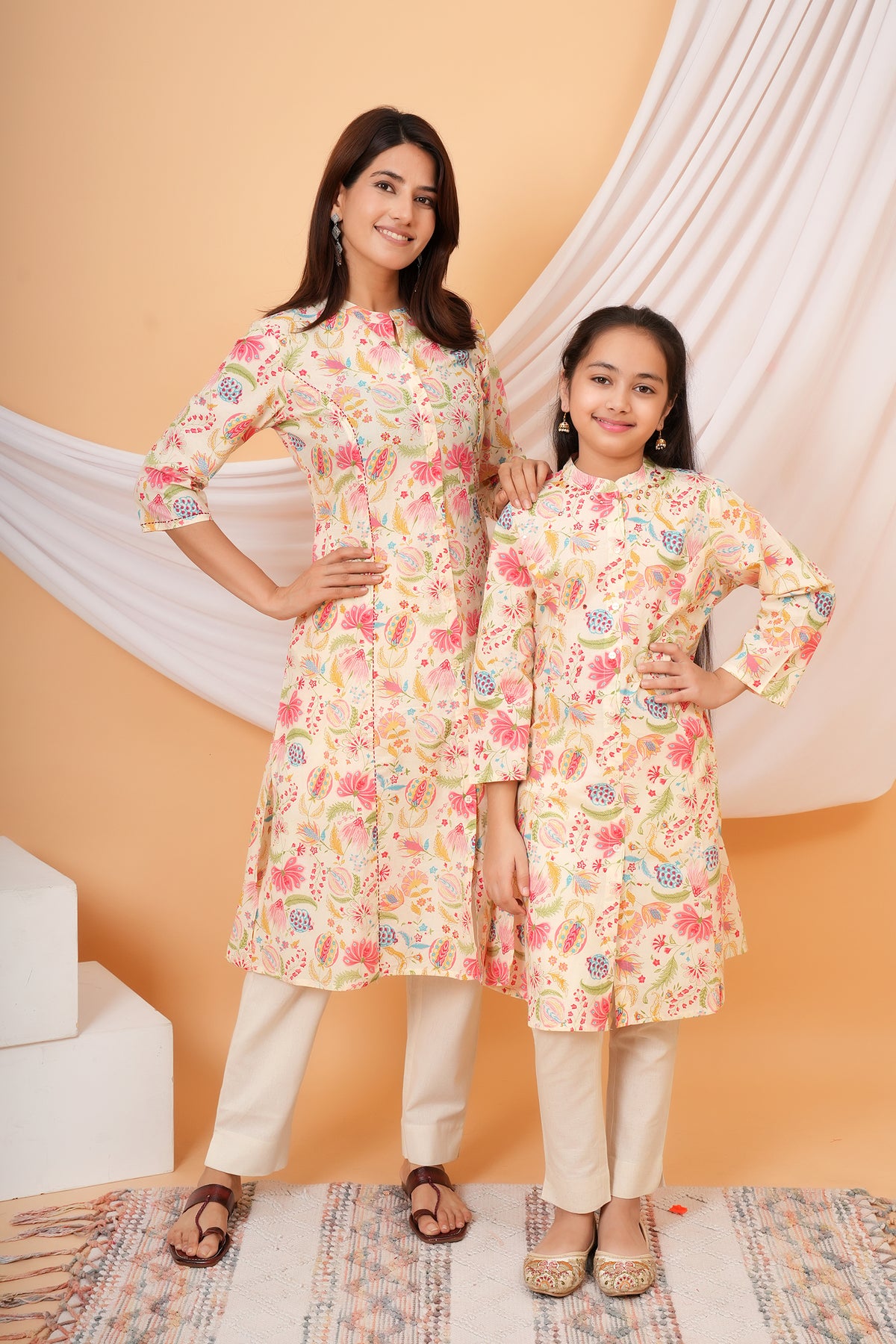 Maa and Beti in matching cream multicolour floral printed kurtis