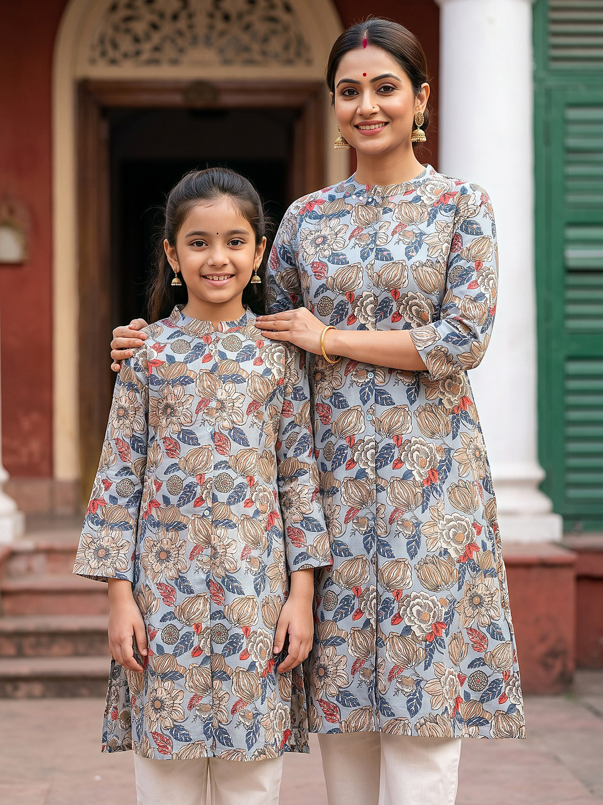 Mother and daughter in matching grey floral printed kurtis