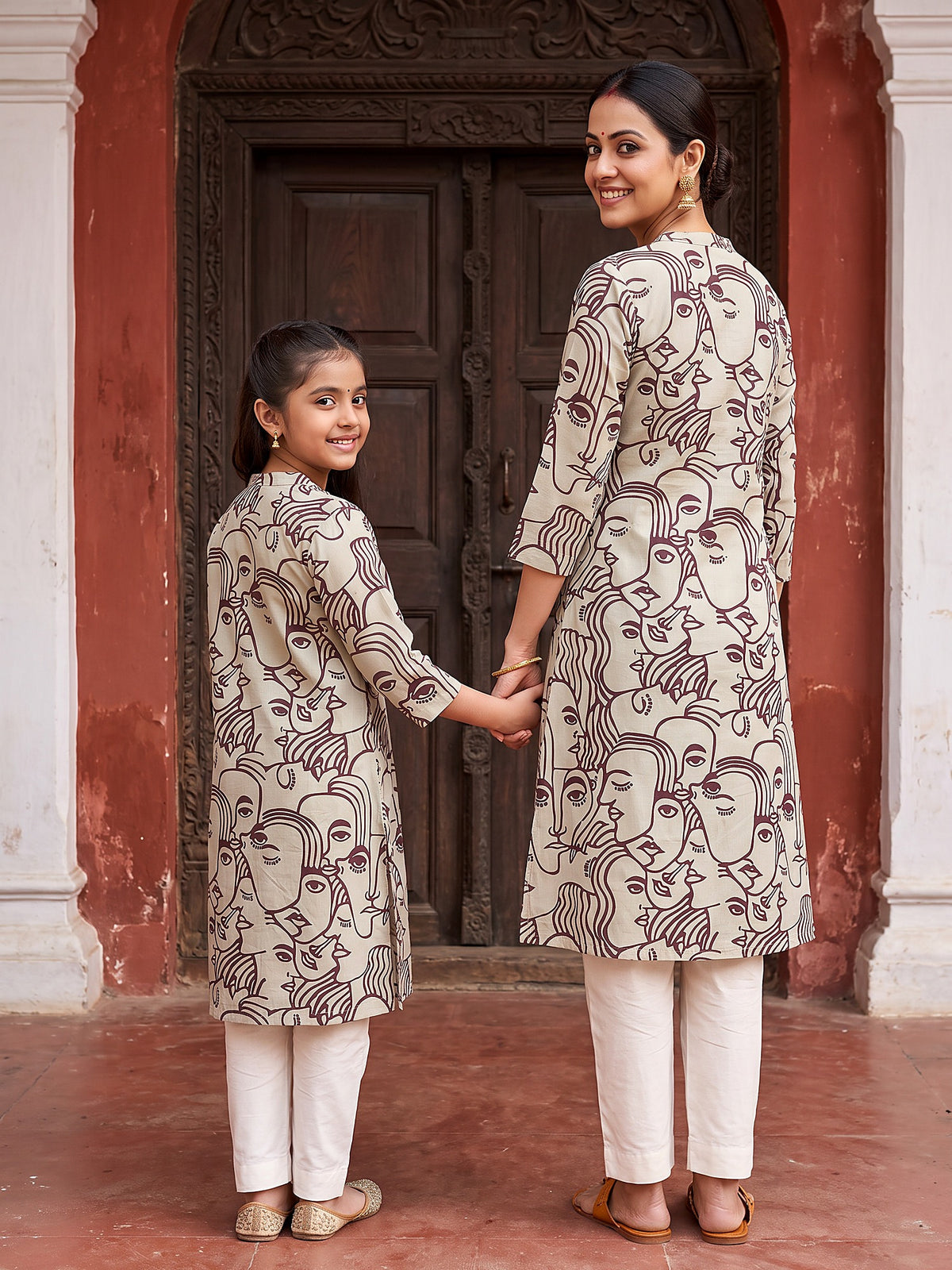 Back view of maroon face art Maa Beti kurtis