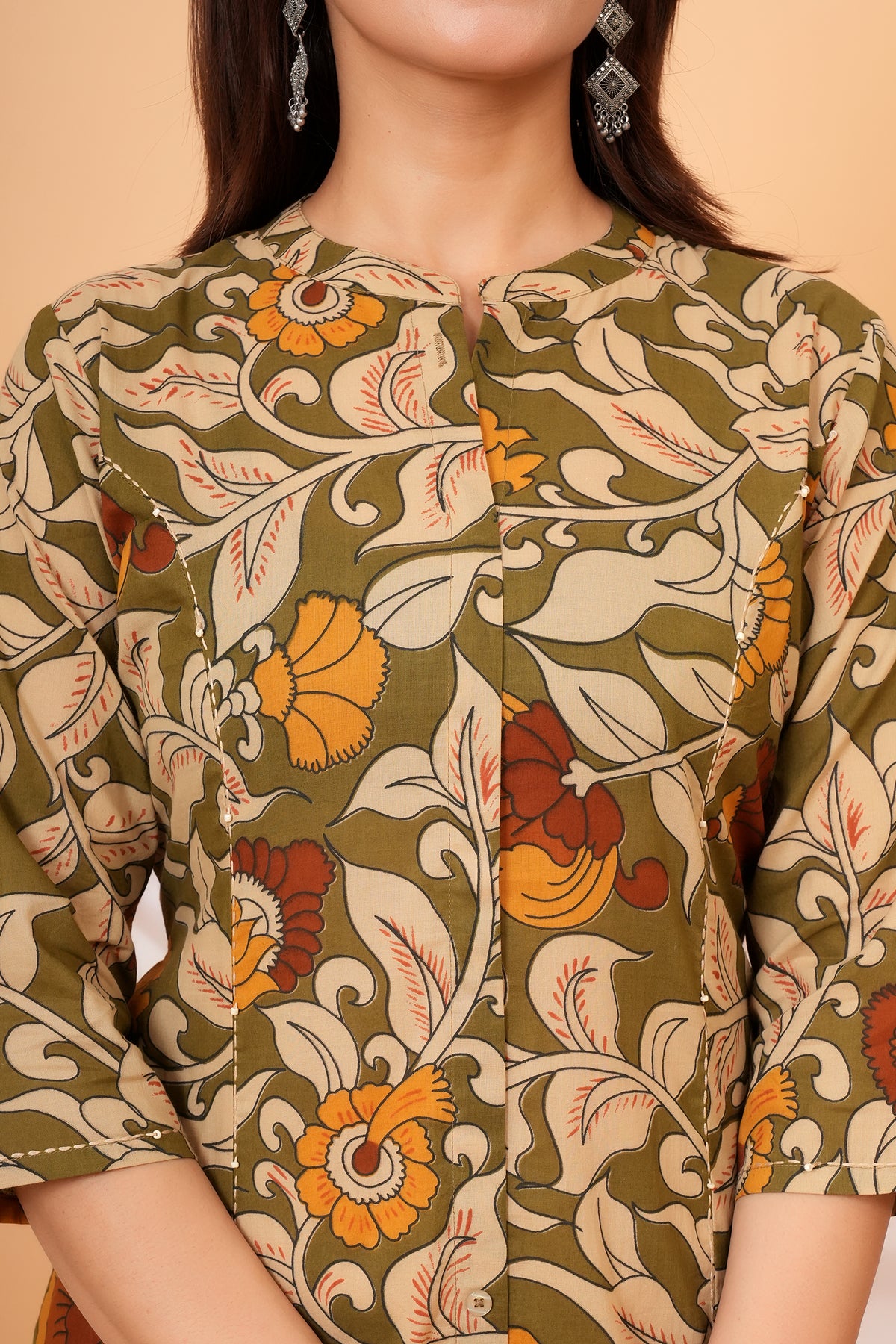 Close-up of the neckline and Kalamkari floral print
