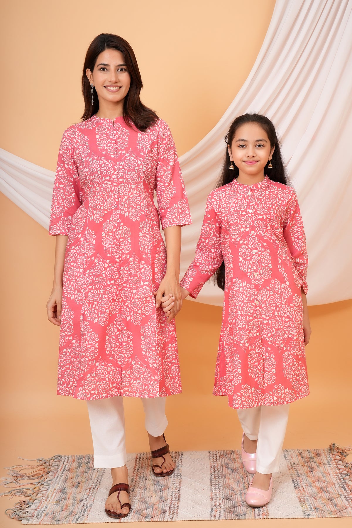 Maa and Beti in matching pink floral jaal printed kurtis