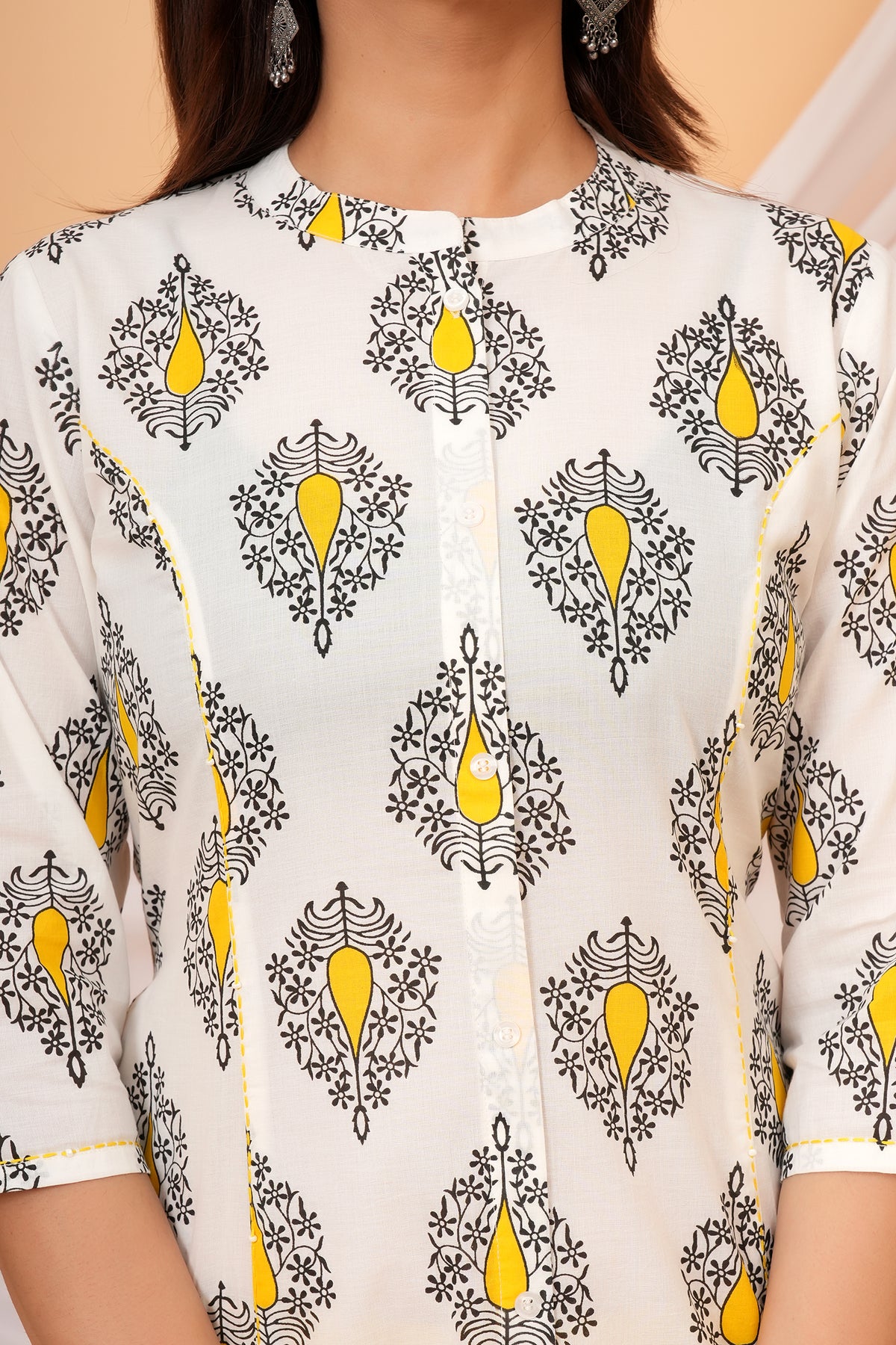 Close-up of the mandarin collar and yellow buta print