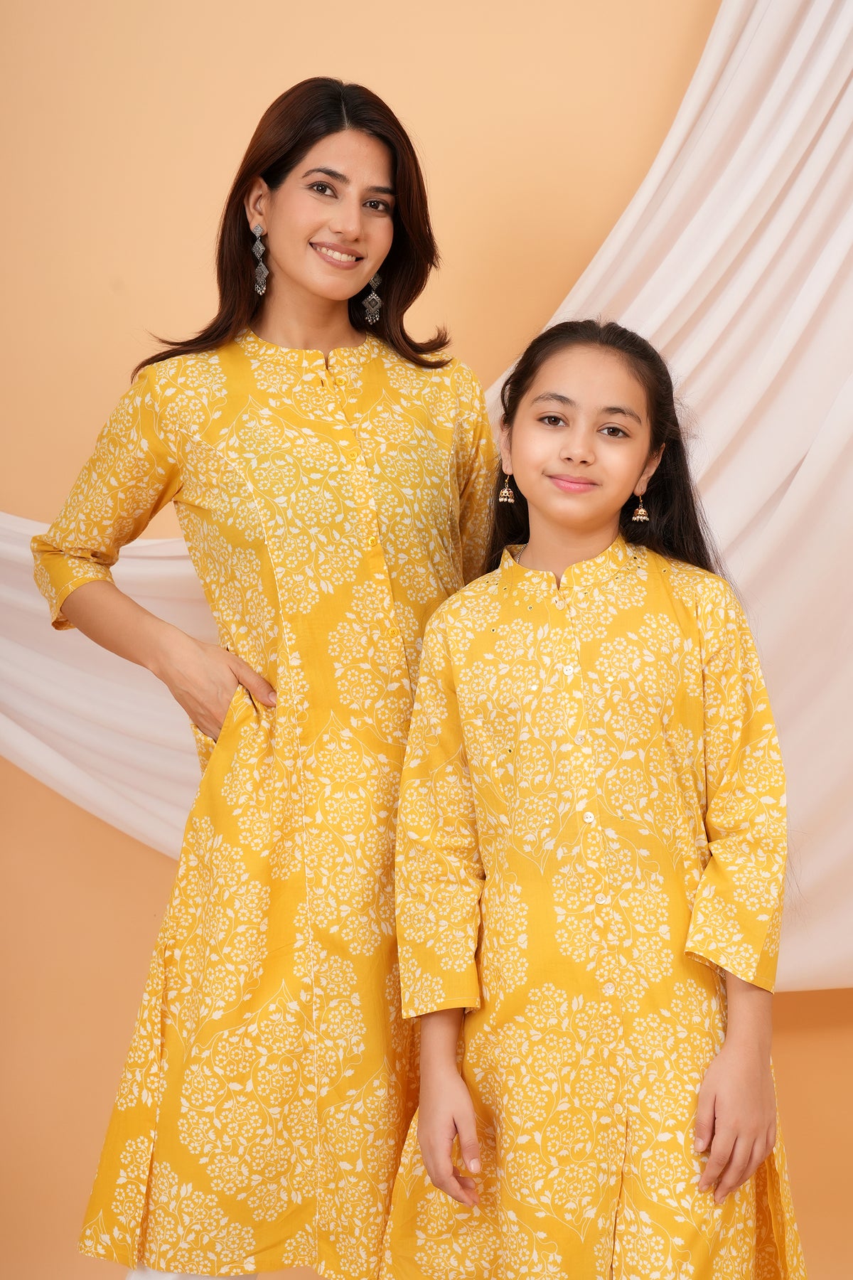 Maa and Beti in matching yellow floral jaal printed kurtis