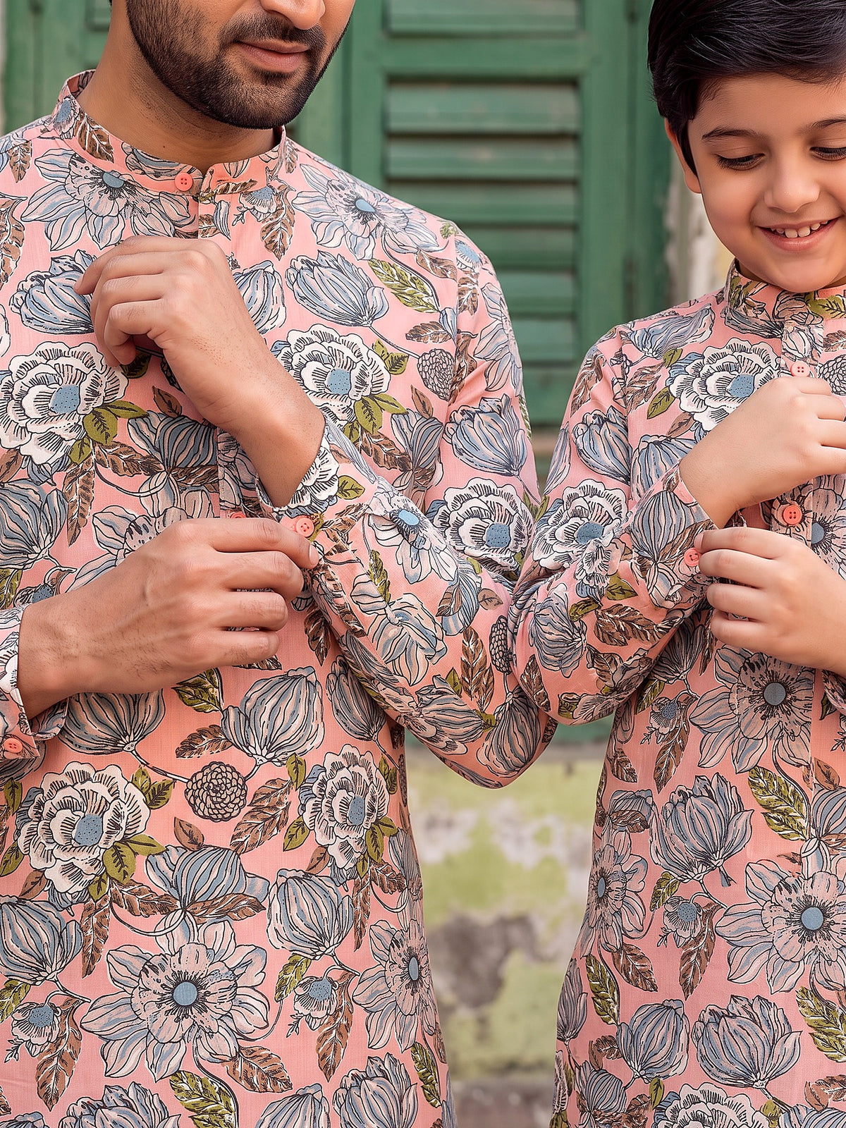 Close-up of buttoned cuff and floral print