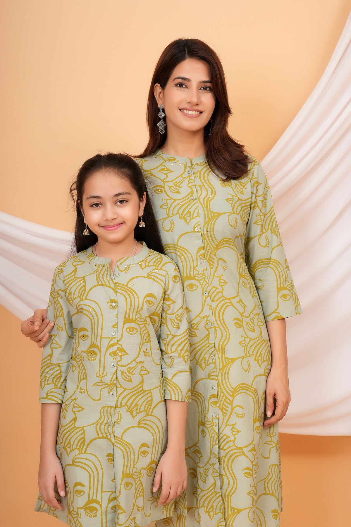 White Solid Base with Abstract Face Art Printed Kurti for Beta - Sage Green