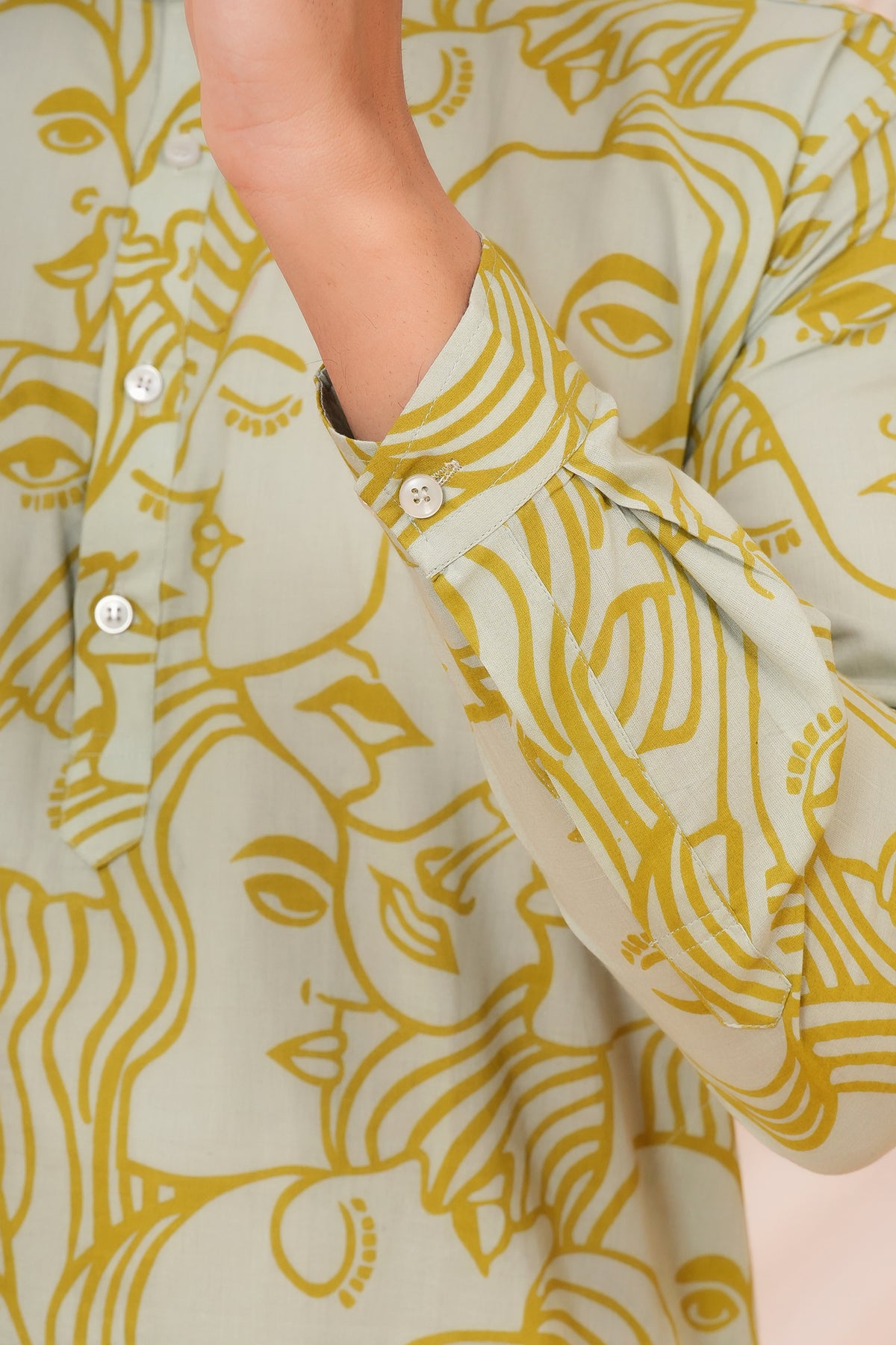 White Solid Base with Abstract Face Art Printed Kurti for Beti - Sage Green