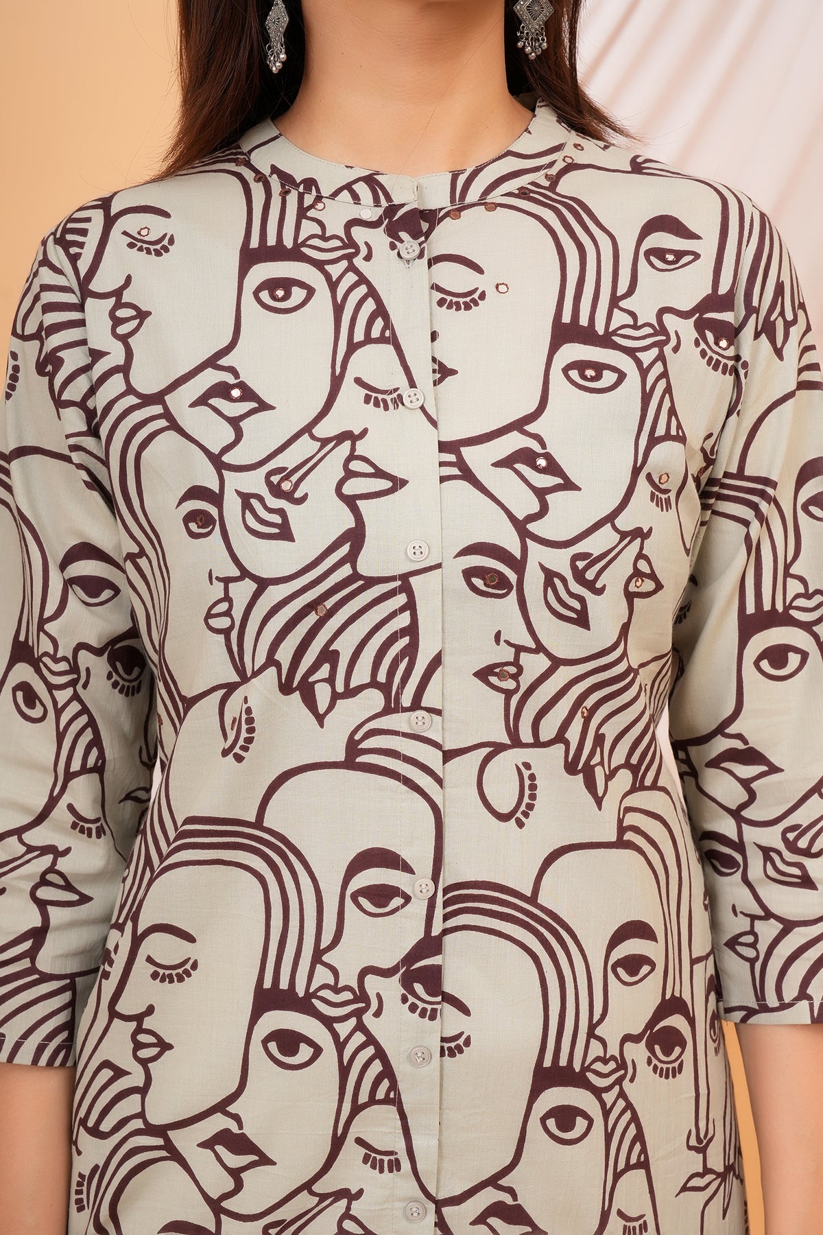 White Solid Base with Abstract Face Art Printed Kurti for Beta - Maroon