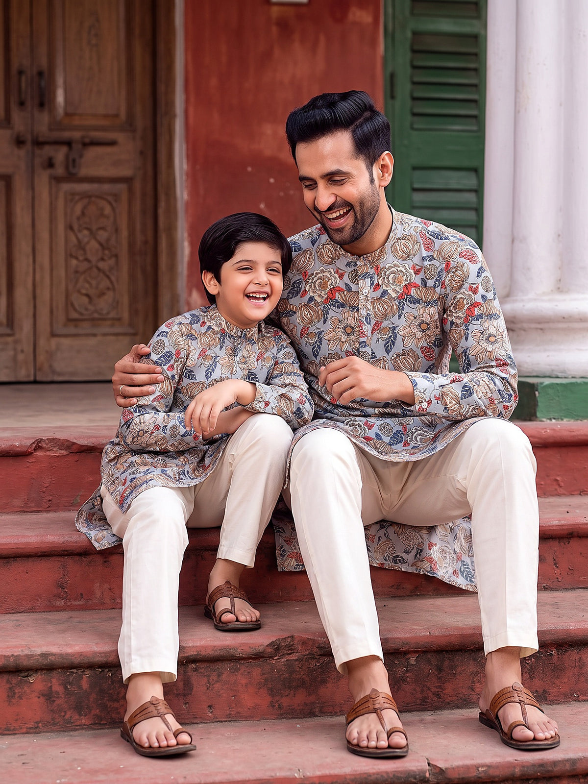 Father and son playing in grey floral kurtas