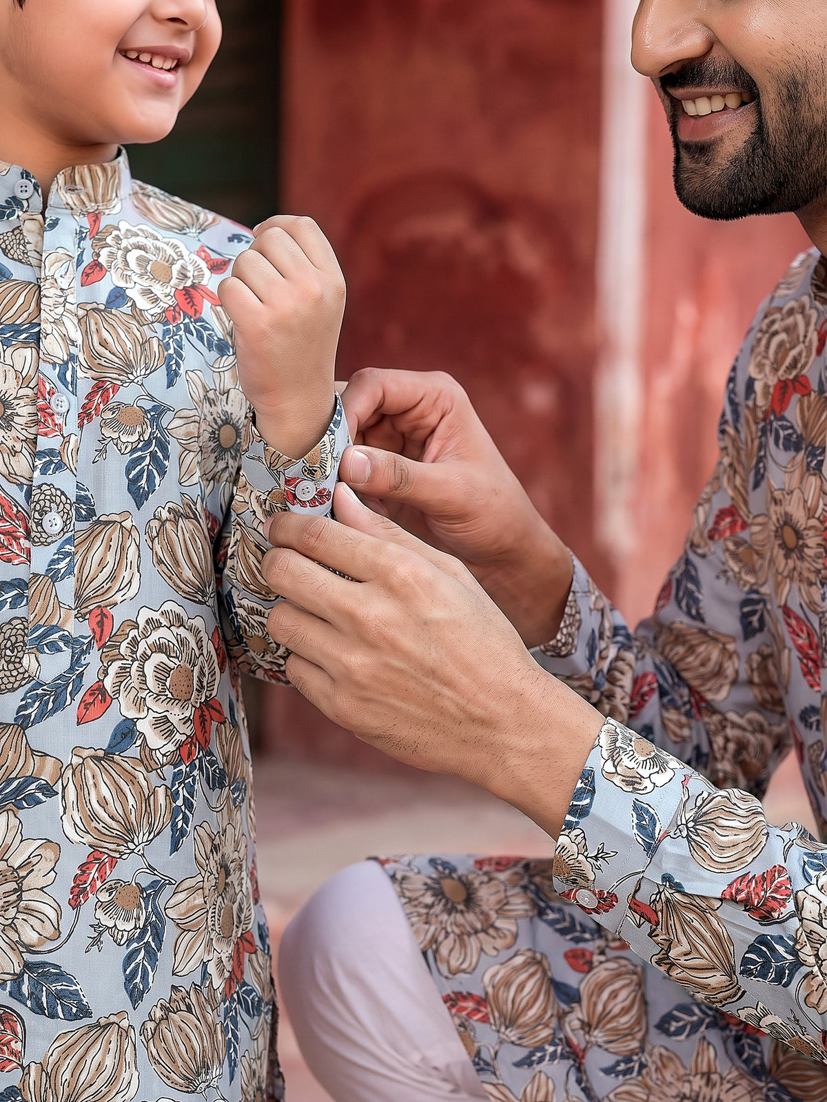 Close-up of buttoned cuff and floral print