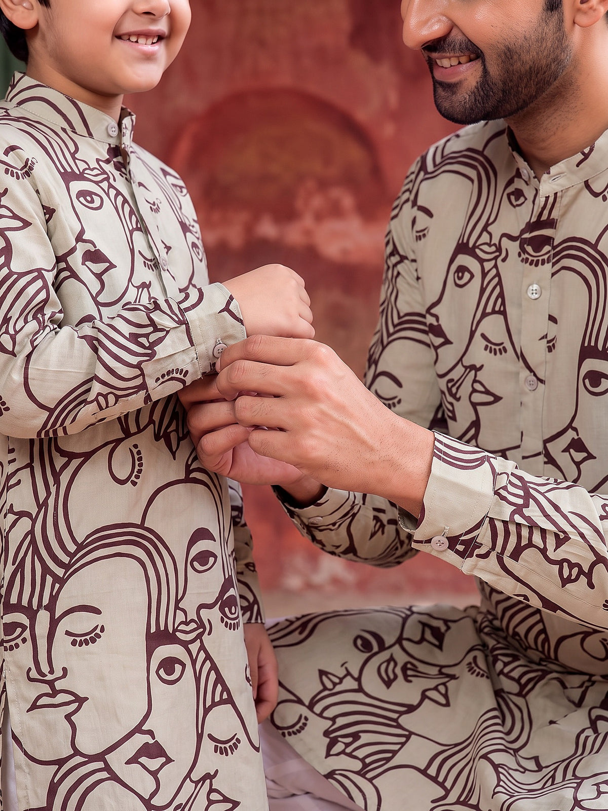 Close-up of buttoned cuff and face art print