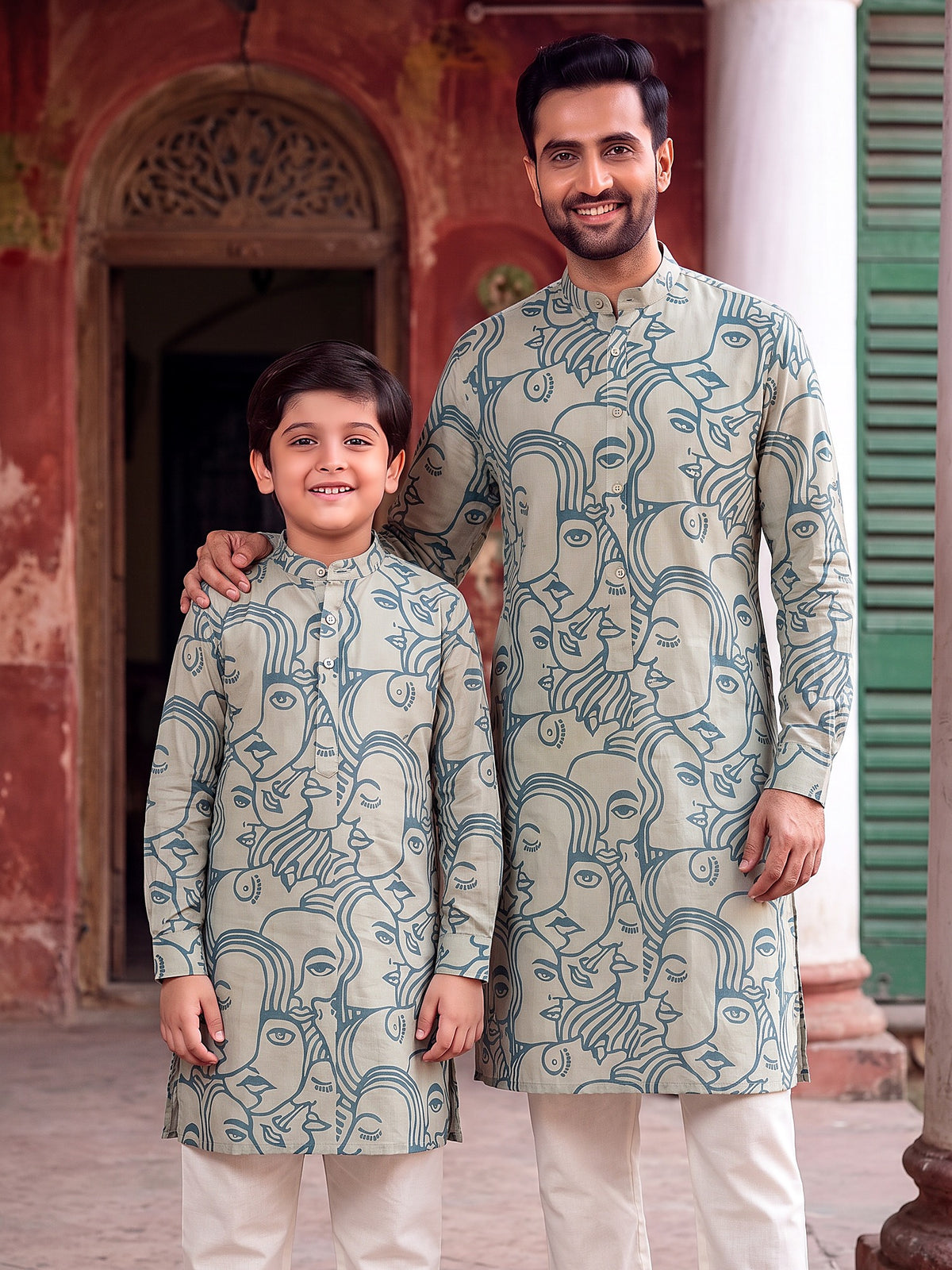 Father and son in matching sky blue face art printed kurtas