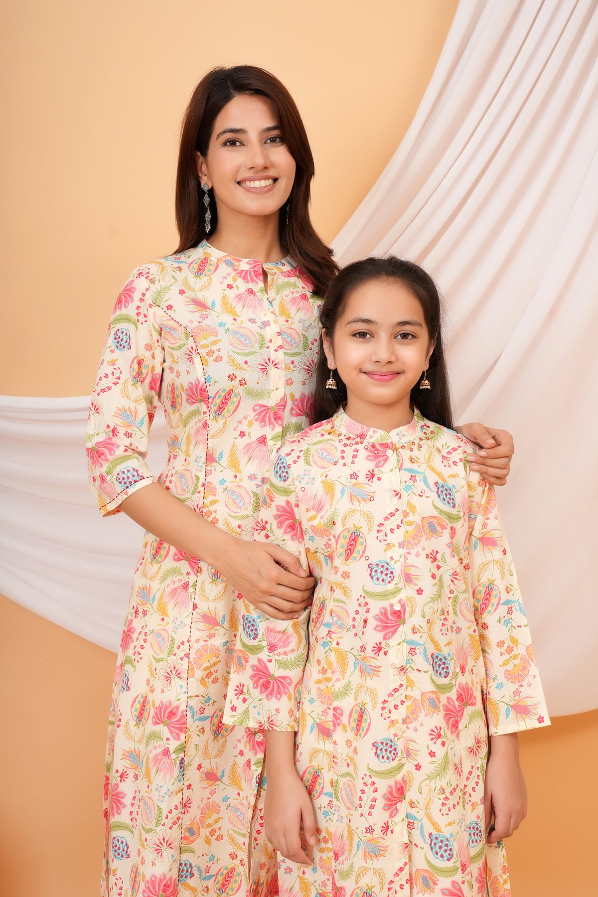 Maa and Beti in matching cream multicolour floral printed kurtis