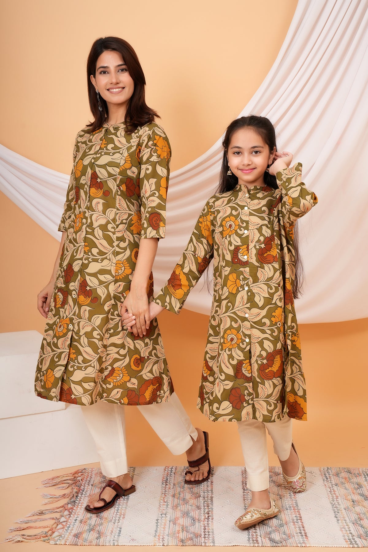 Maa and Beti in matching olive green Kalamkari floral printed kurtis