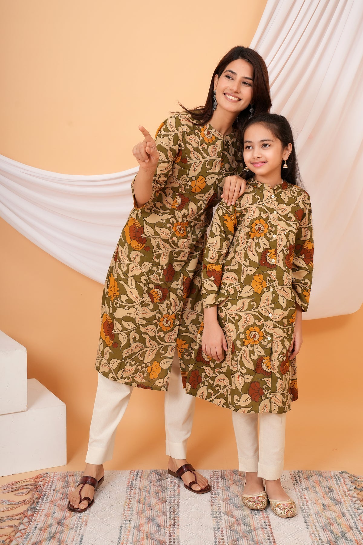 Maa and Beti in matching olive green Kalamkari floral printed kurtis