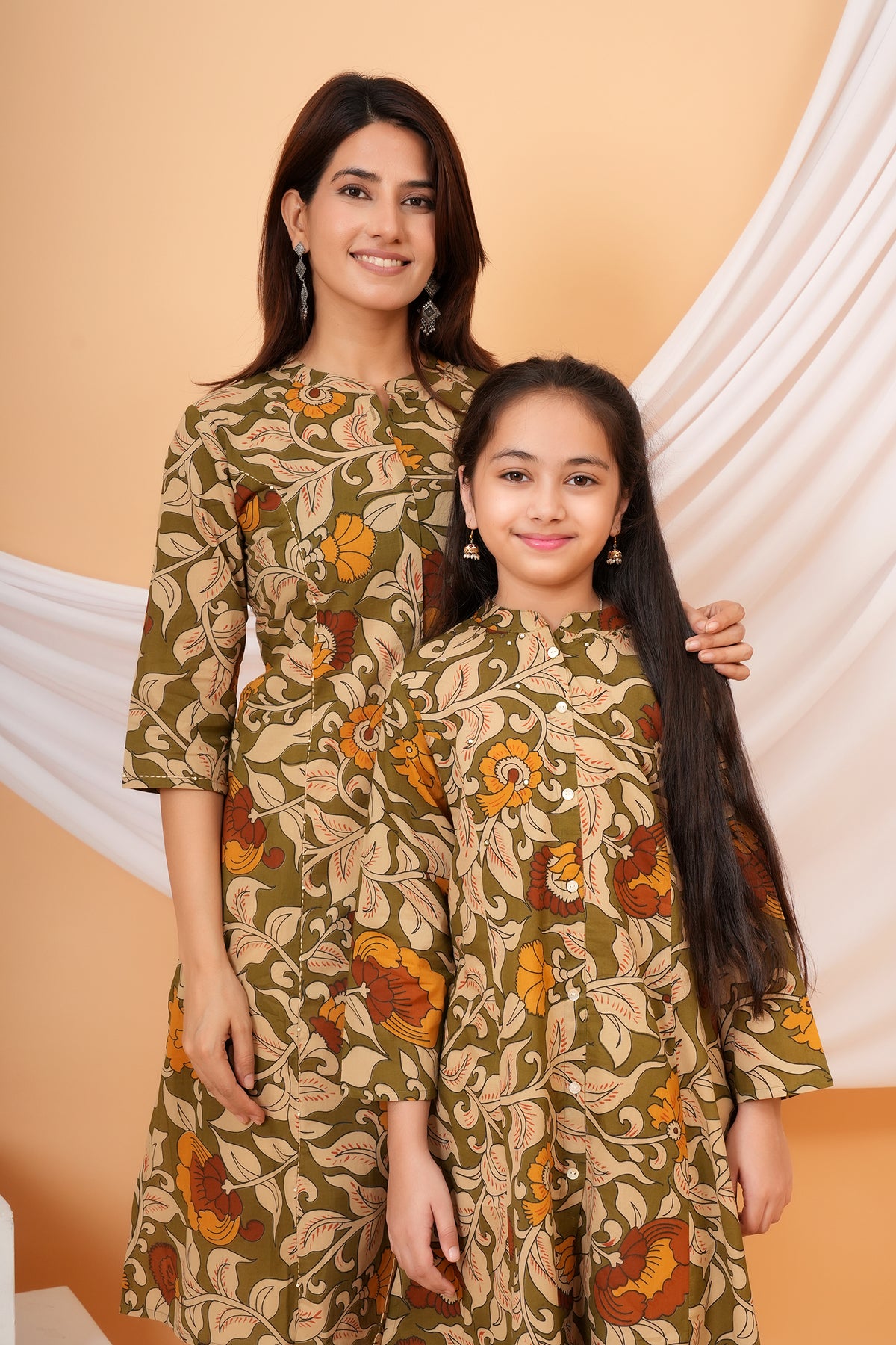 Maa and Beti in matching olive green Kalamkari floral printed kurtis